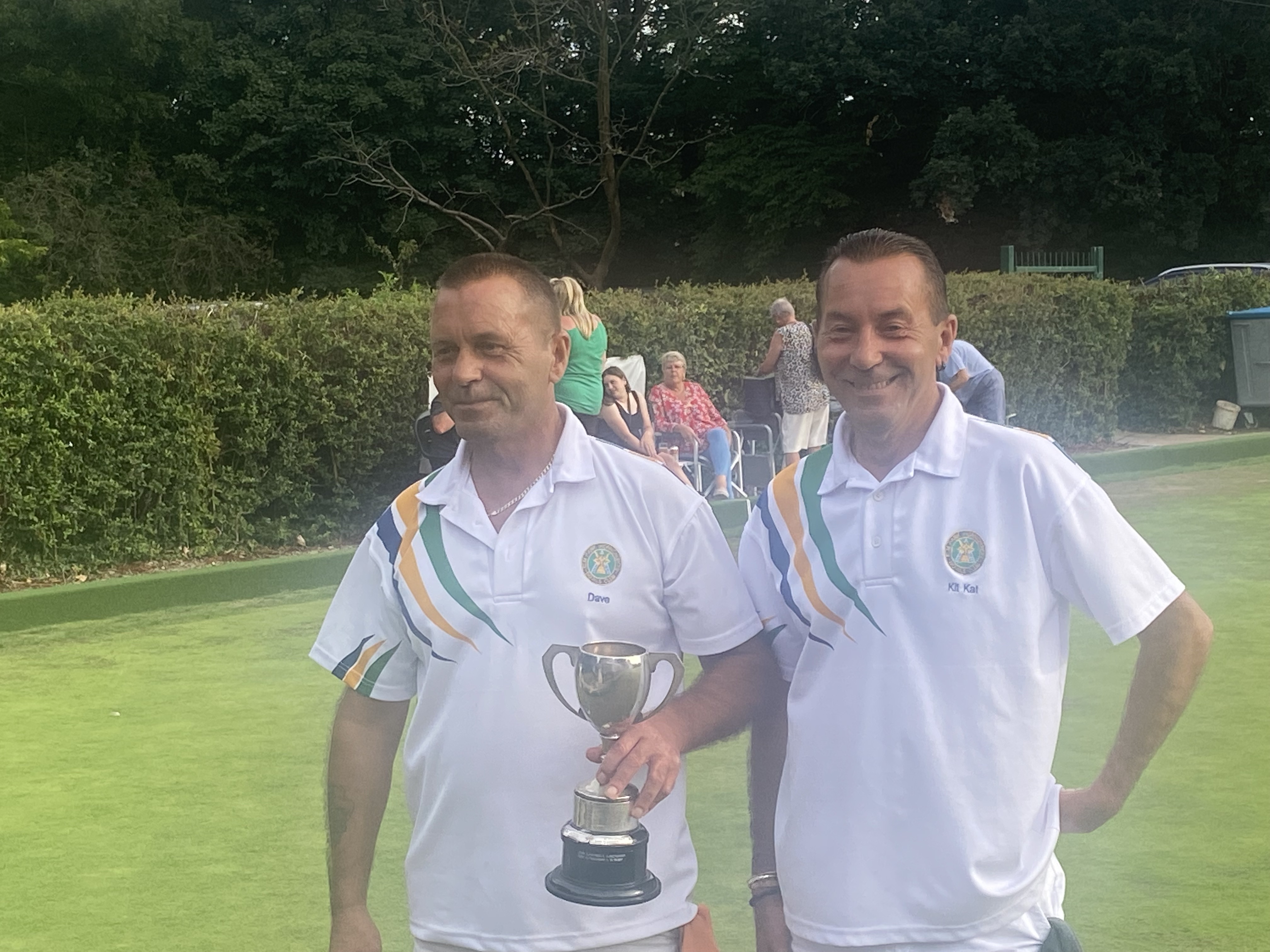 photo showing the Curtis twins with the trophy.